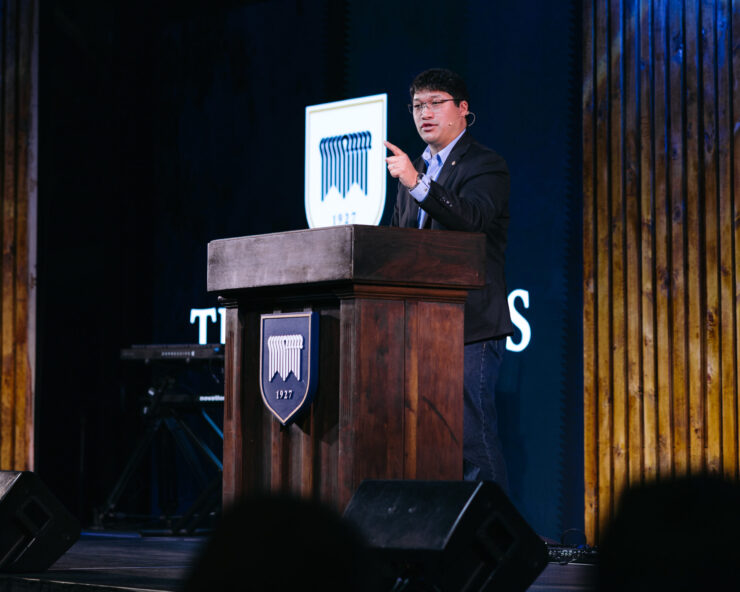 Dr. Abner Chou preaching.